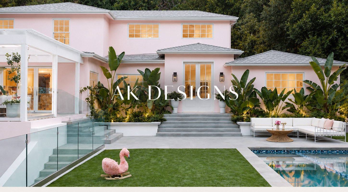 Pink Spanish Revival residence with pool and lush landscaping